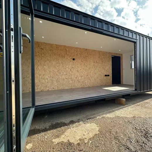 CONTENEDOR DE OFICINA 6,4 X 2,4 M CON PUERTA PLEGABLE